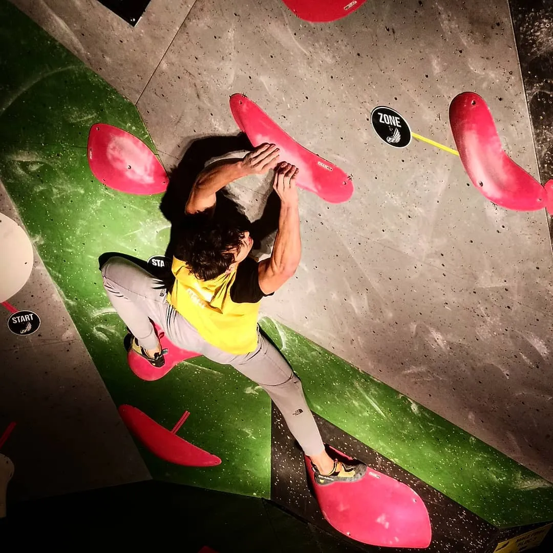 Climber on a bouldering wall during a Blokfest event